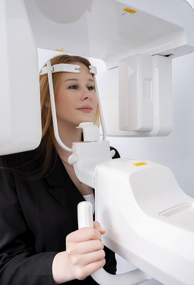 Patient undergoing CBCT scan for oral cancer screening and diagnostic dental evaluation at Dental Pearl Miami in North Miami Beach FL