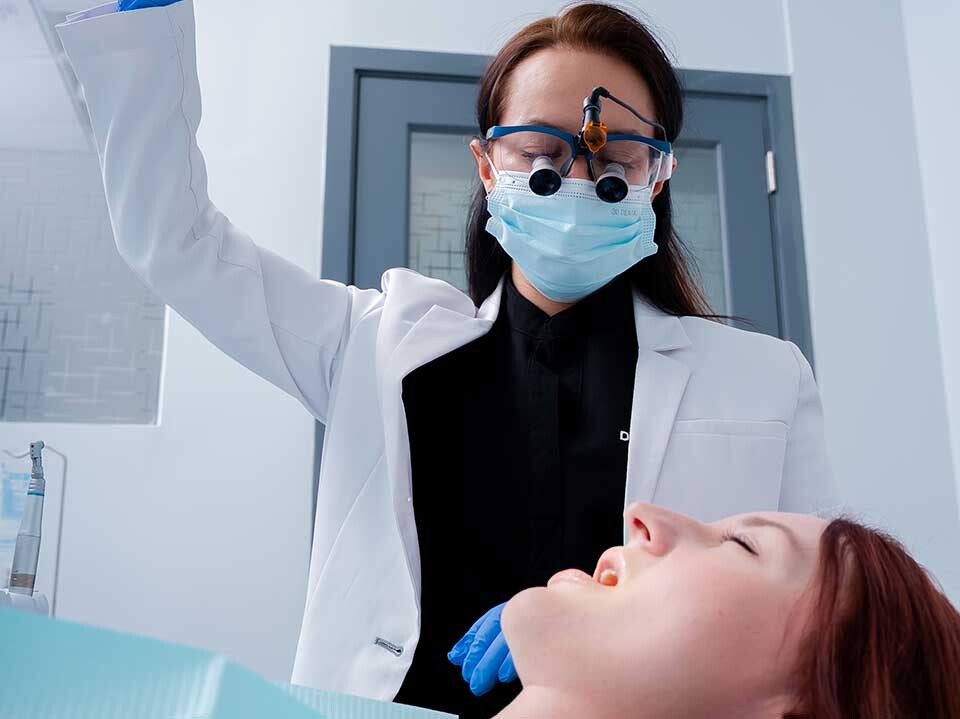 Dentist performing single tooth dental implant procedure at Dental Pearl Miami in North Miami Beach FL