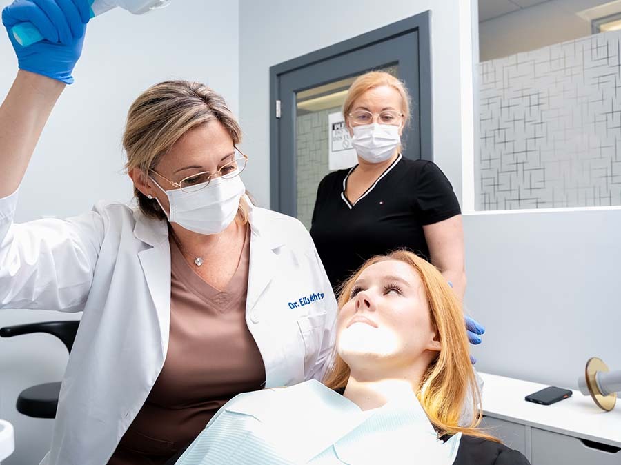 patient receiving professional teeth whitening treatment at Dental Pearl in North Miami Beach FL